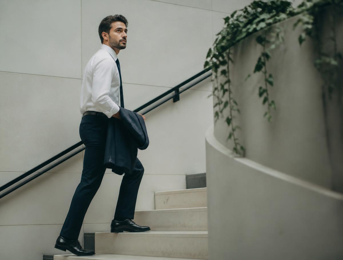 A recruitment professional walking up a staircase